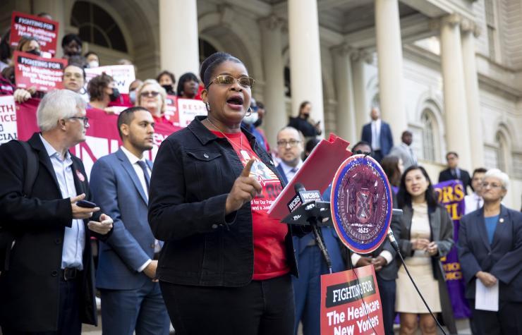 Judith Cutchin, DNP, RN surrounded NYC Council legislators at a rally