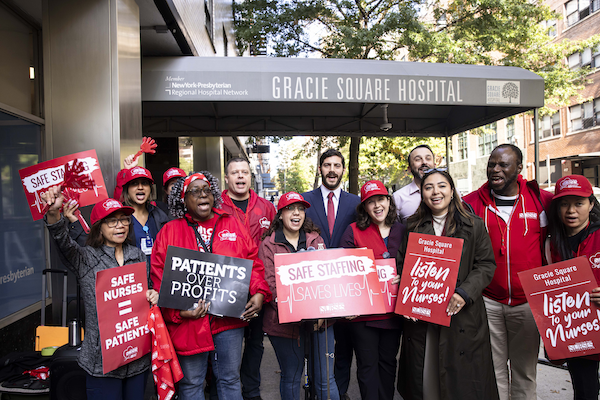 Nurses pose with allies during an informational picket at Gracie Square Hospital