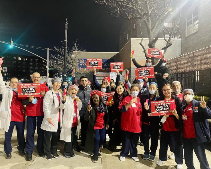 Elmhurst nurses gather outside the hospital with signs demanding Safe R.N. Staffing 