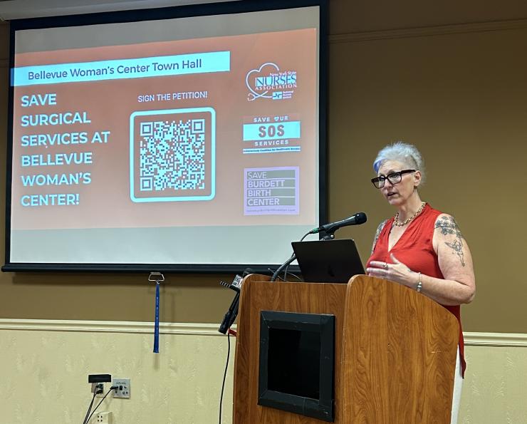 NYSNA member Dawn Zipp, RN, speaks at a town hall about the need to save surgical services at Bellevue Woman's Center