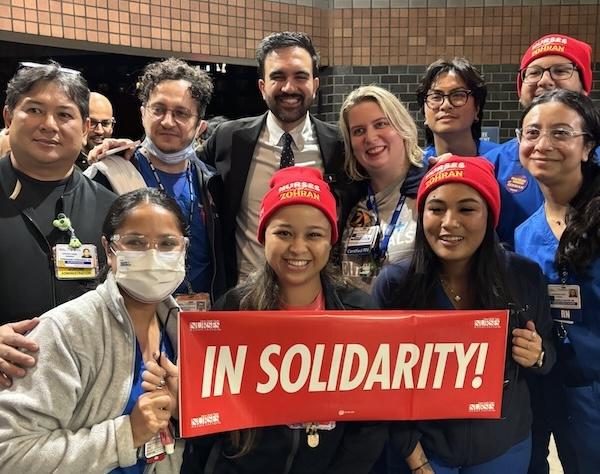 NYSNA members holding signs with NYC Mayor-elect Zohran Mamdani