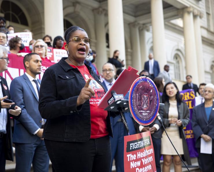 Judith Cutchin, DNP, RN surrounded NYC Council legislators at a rally