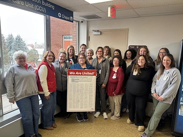 Nurses Pose with a Copy of their Bargaining Platform, After Delivering it to Hospital Management
