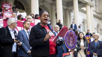 Judith Cutchin, DNP, RN surrounded NYC Council legislators at a rally