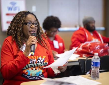 NYSNA nurse speaking into microphone at educational workshop