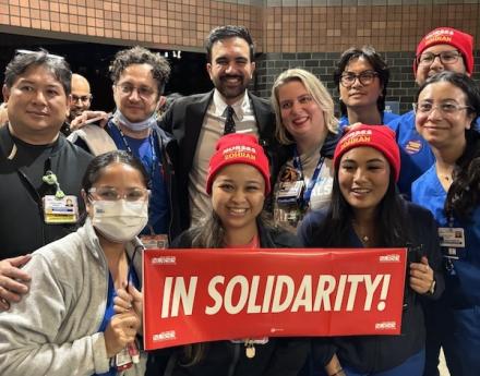 NYSNA members holding signs with NYC Mayor-elect Zohran Mamdani