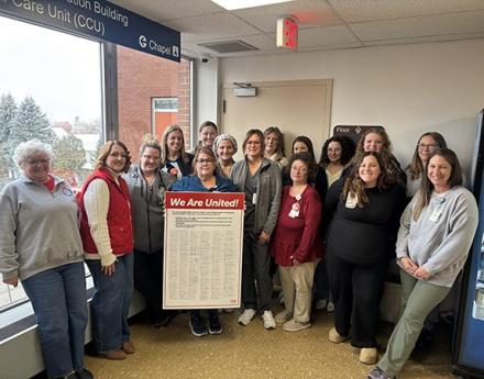 Nurses Pose with a Copy of their Bargaining Platform, After Delivering it to Hospital Management